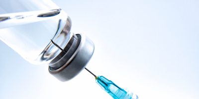 Syringe drawing from a medicine vial