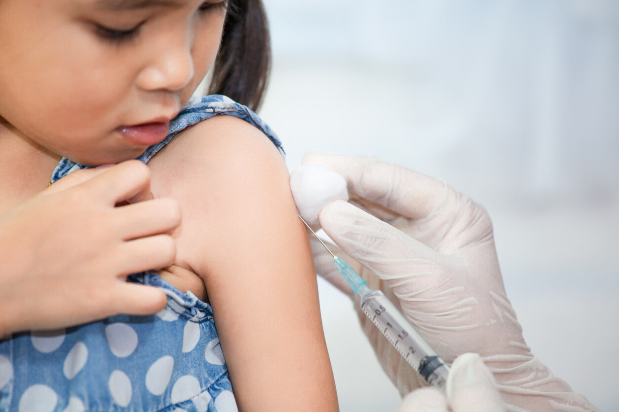 young girl receiving vaccine