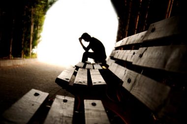 Depressed male in tunnel