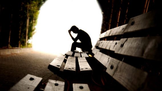 Depressed male in tunnel