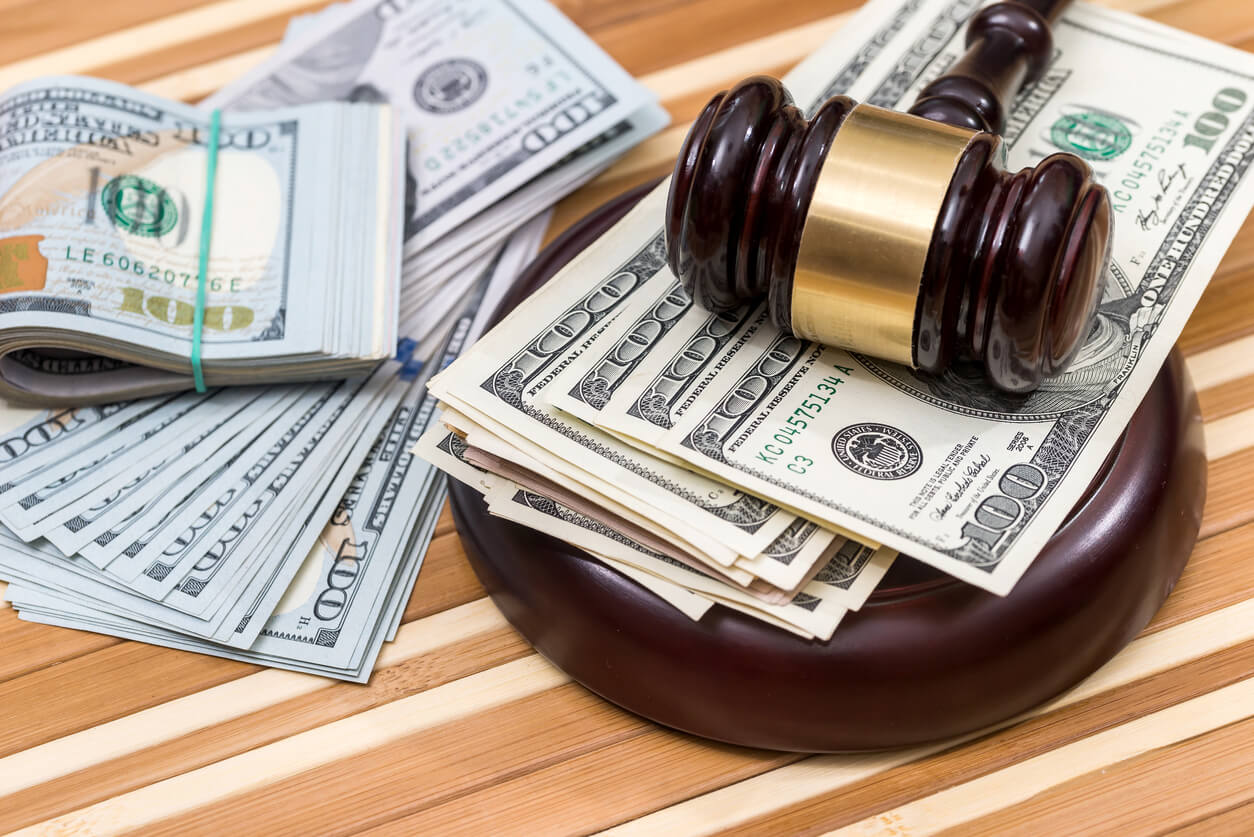 Wooden gavel with money