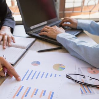 Professionals analyzing medical graphs