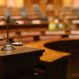 scales of justice in court room