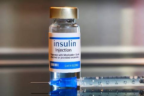 Vial of insulin with needle