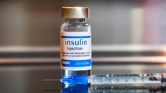 Vial of insulin with needle