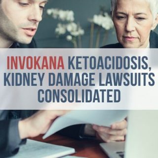 two lawyers reading a document in front of a laptop