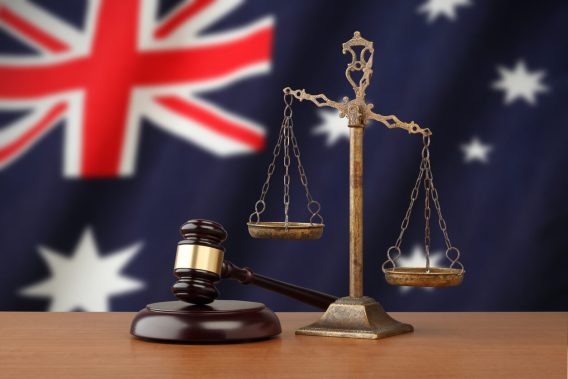 Gavel and scales with Australia flag background