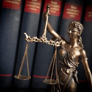Legal scales of justice with books