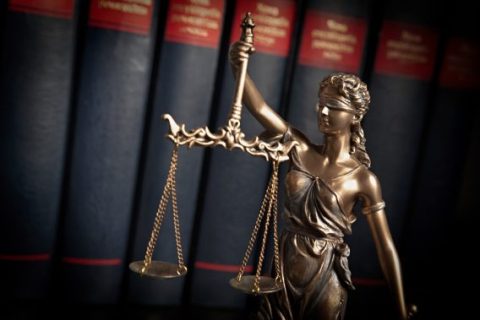 Legal scales of justice with books
