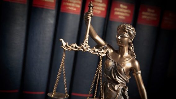 Legal scales of justice with books