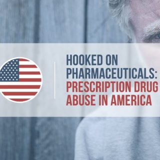 Clopseup of a man in front of a tall wooden fence