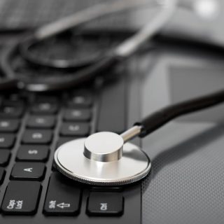 Stethoscope on a computer keyboard