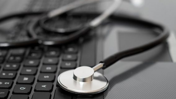 Stethoscope on a computer keyboard