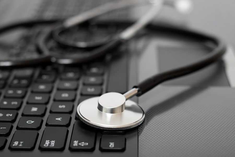 Stethoscope on a computer keyboard