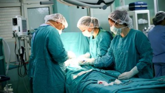 doctors performing surgery on a small patient
