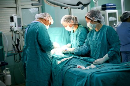 doctors performing surgery on a small patient