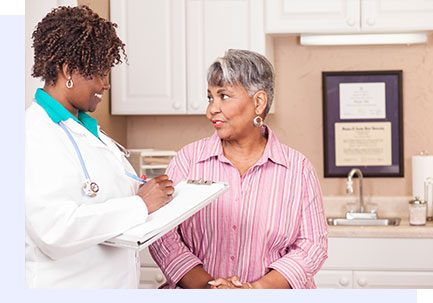 middle aged woman consulting a doctor