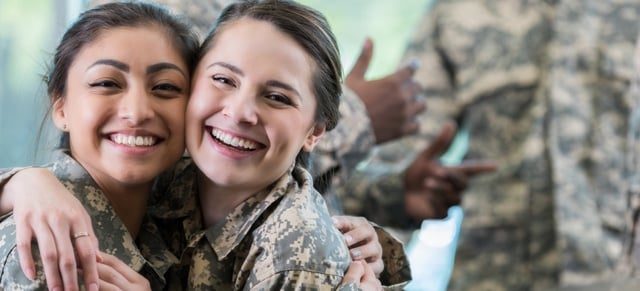 Two soldiers hugging each other