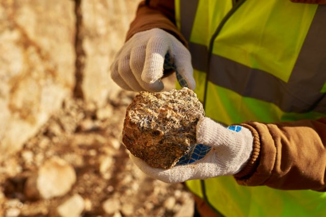 Miner Holding Chunk of Mineral