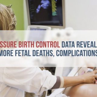 Nurse giving ultrasound to pregnant woman
