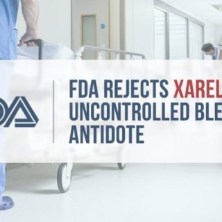 male nurse pushing an empty hospital bed