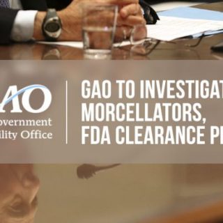 Reflection of older man speaking at a hearing