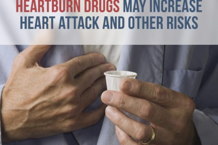 Man holding medication cup