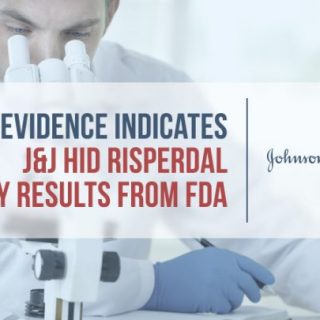 Doctor looks into microscope in laboratory and takes notes