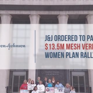 Women in front of courthouse hold Mesh awareness signs