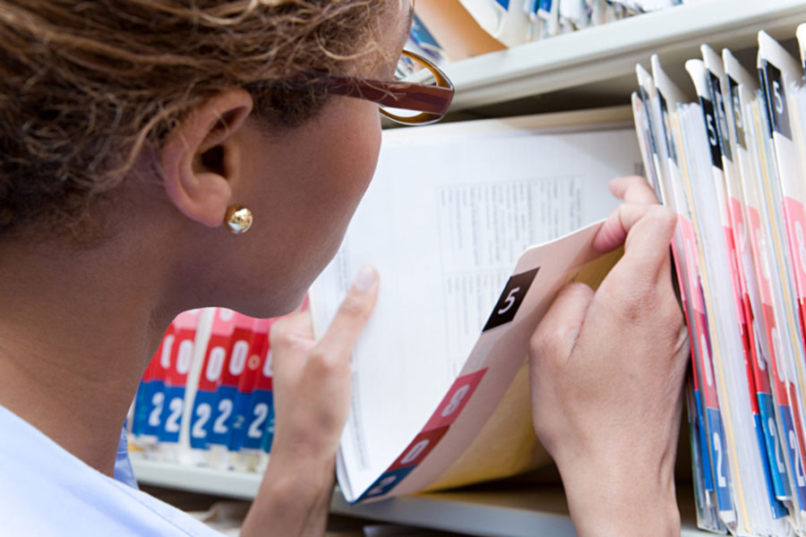 woman looking at a file