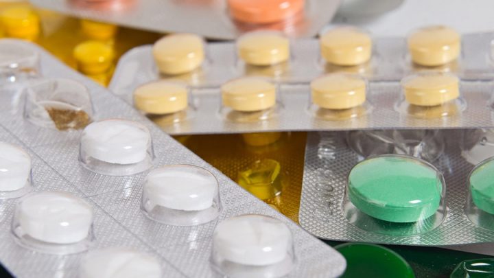 assortment of different colored pills in popcorn packaging