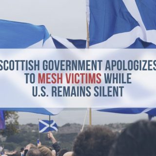 Crowd holding Scottish flags
