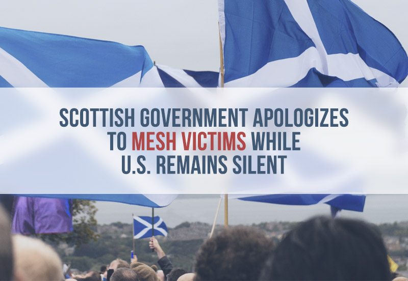 Crowd holding Scottish flags