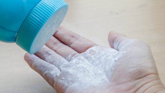 Pouring talcum powder onto open palm