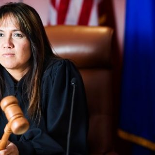 female judge holding a gavel