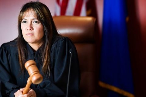 female judge holding a gavel