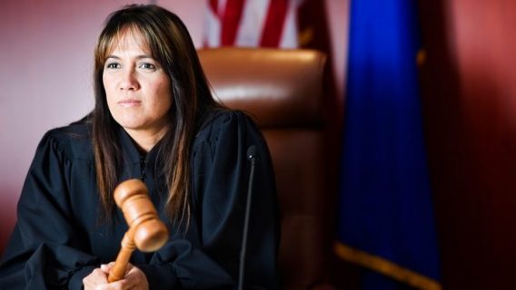 female judge holding a gavel