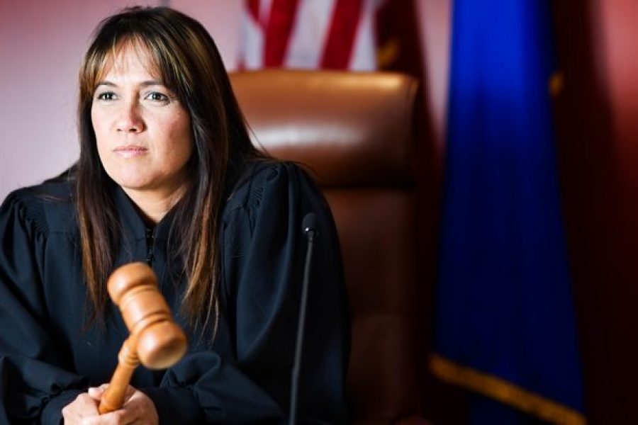female judge holding a gavel