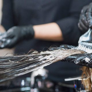 Woman having a hair product applied.