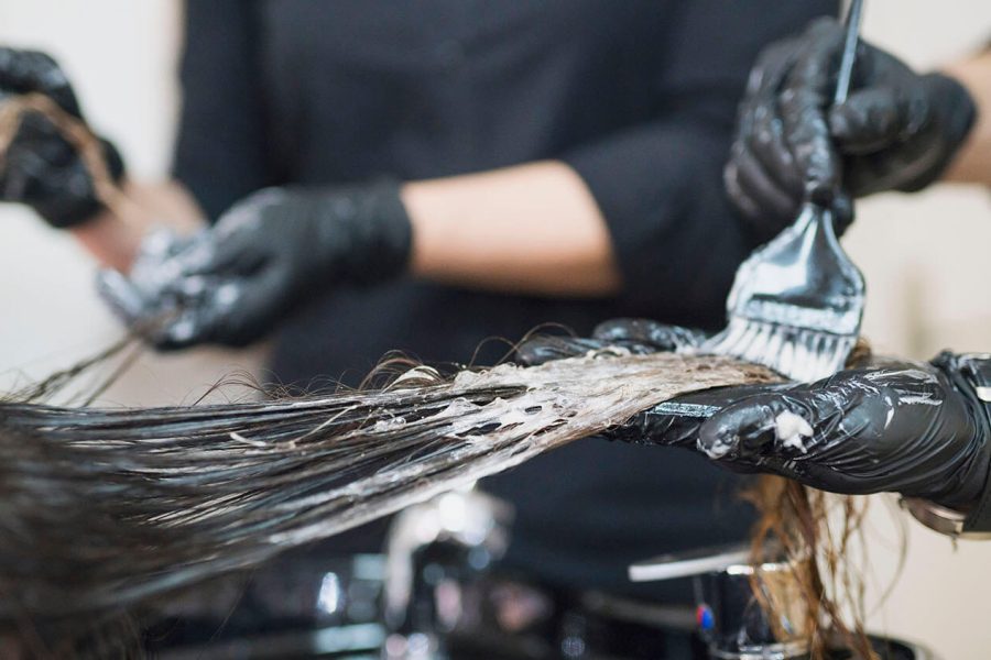 Woman having a hair product applied.