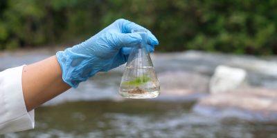Person testing for water contamination