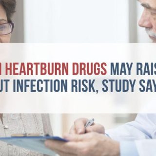 doctor and middle-aged woman looking at a medical chart