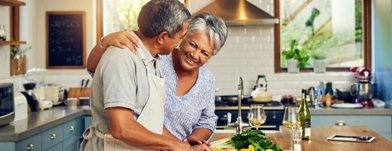 elderly couple cooking in the kitchen