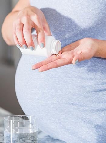 Pregnant Woman Taking Medication