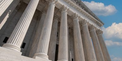 Marble columns and steps of the U.S. Supreme Court building viewed from below