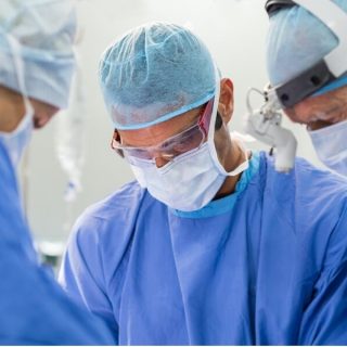 Doctors completing surgical procedure