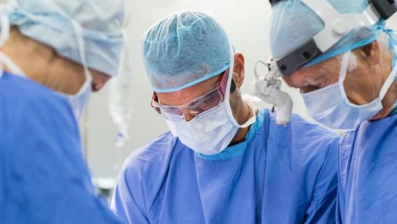 Doctors completing surgical procedure