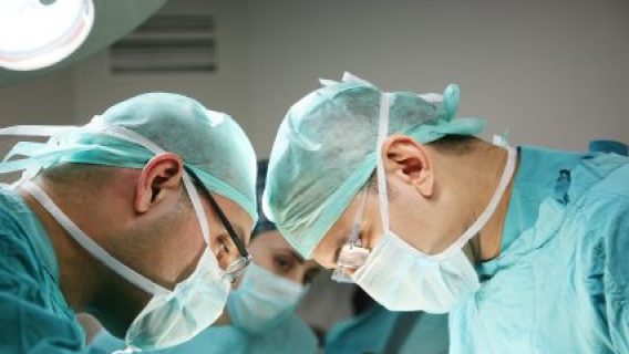 Two surgeons looking down