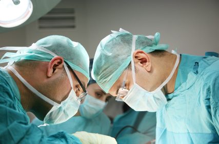 Two surgeons looking down