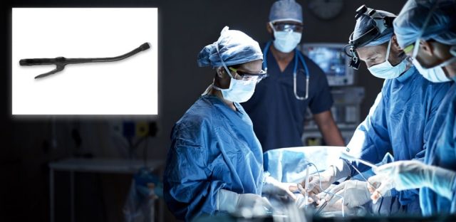 Surgeons using surgical stapler during surgery